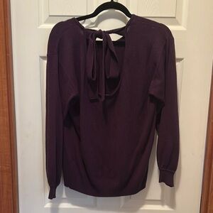 New York and Company size L. Women's Purple Sweater with cute tie bow back.